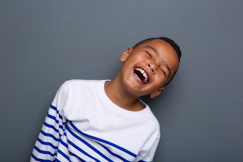 portrait of a little boy laughing